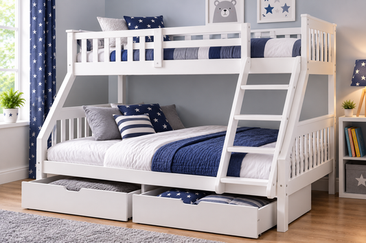 White wooden triple bunk bed with ladder, single top bunk and double bottom bunk, navy star bedding and two storage drawers.