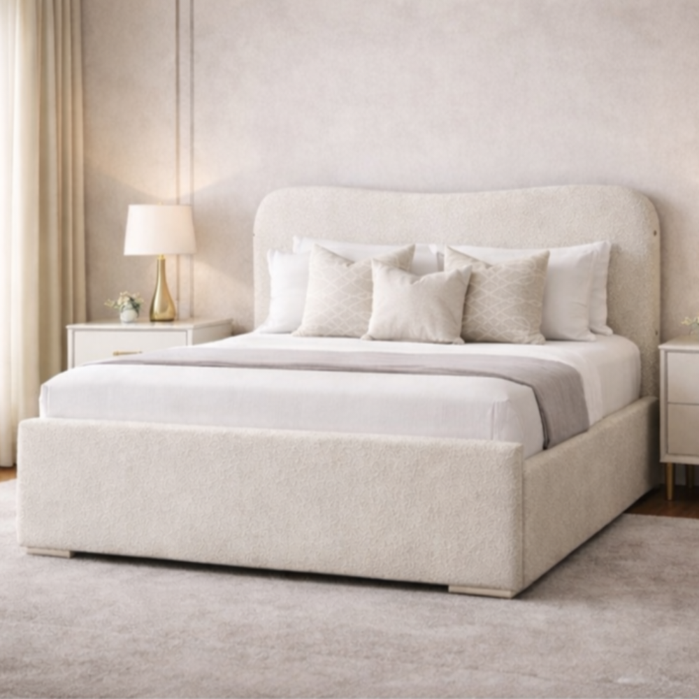 The Blush Haven Kids Bed in soft cream fabric with curved headboard and padded base styled in bright modern bedroom interior.