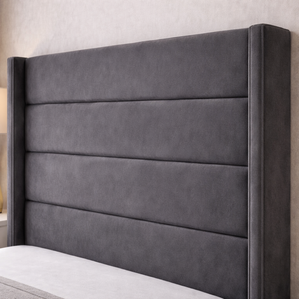 The Imperion Wingback Luxury Bed close up of grey upholstered winged headboard with horizontal panels in modern bedroom interior.