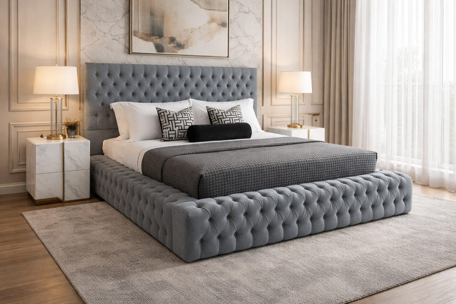 Gray tufted bed in a stylish bedroom with lamps and decor.