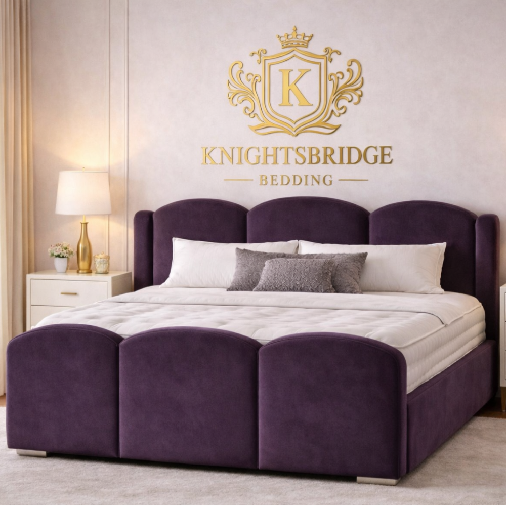 The Mayfair Wingback Luxury Bed in plush purple velvet with curved headboard and matching footboard in stylish modern bedroom.