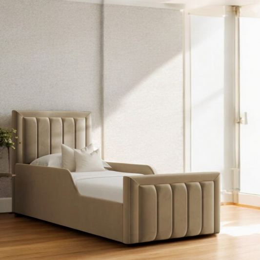 Nolan luxury panel bed with upholstered headboard and padded frame styled in a bright modern bedroom.