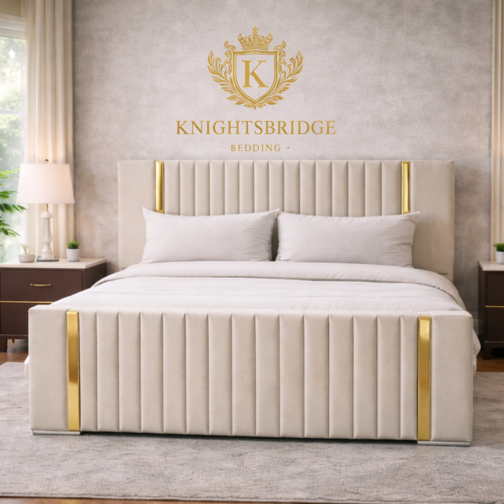 Beige bed with gold accents in a bedroom setting, featuring the Knightsbridge Bedding logo.