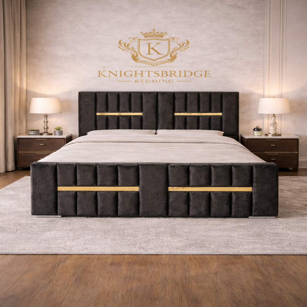 The Waterloo Luxury Panel Bed with dark velvet panels, gold accent bars, tall headboard and matching footboard in elegant bedroom setting.