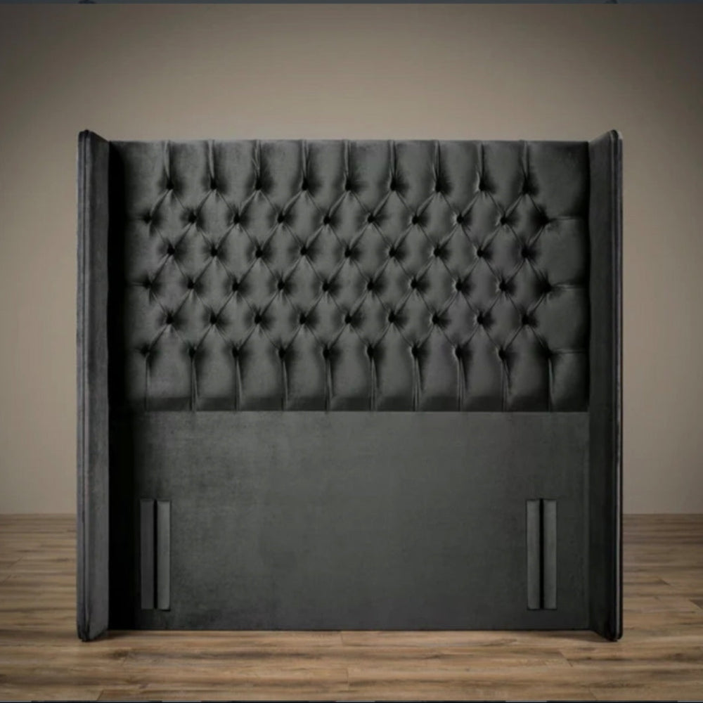 Windsor divan ottoman bed headboard with deep button tufting and winged sides, shown front-on in a modern room.