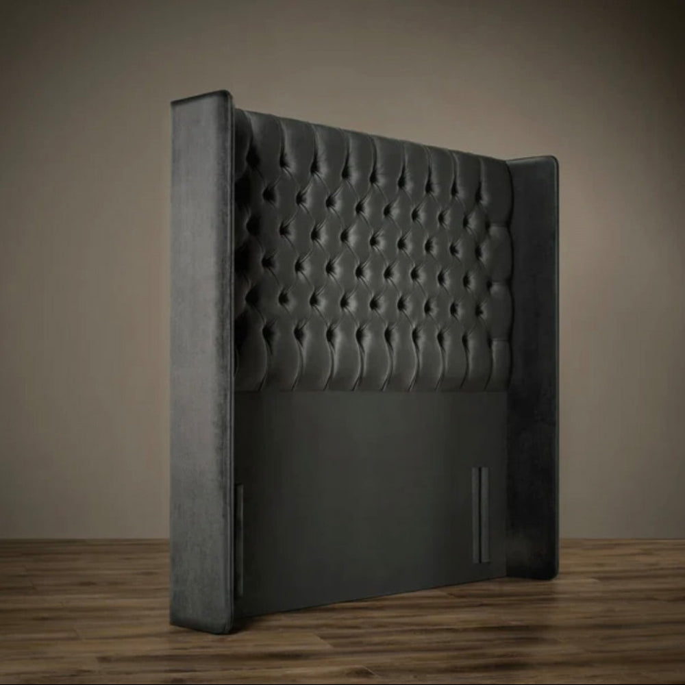 Windsor divan ottoman bed headboard with deep button tufting and winged sides shown in a luxury bedroom setting.